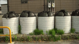 Bags of contaminated soil placed in tile drainage pipes located in Hayama, Koriyama City. Radiation levels can range from 0.3~0.7 µSv/hr [June 2015]